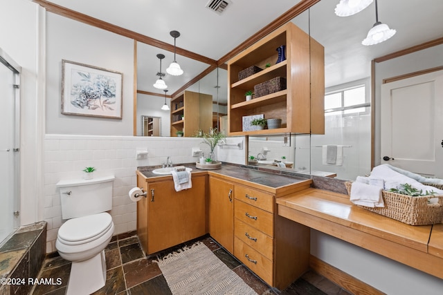 bathroom featuring toilet, vanity, ornamental molding, tile walls, and tasteful backsplash