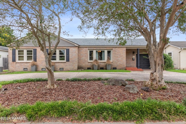 ranch-style home with a garage