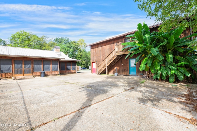 view of home's exterior featuring a sunroom