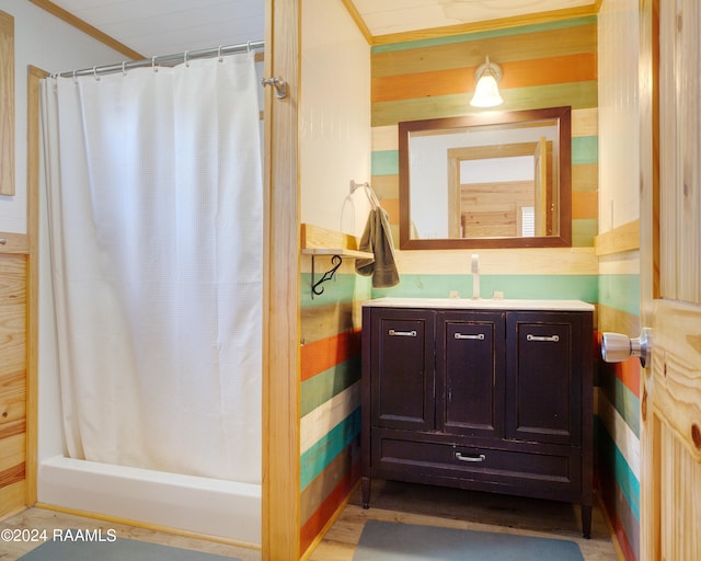 bathroom featuring walk in shower and vanity