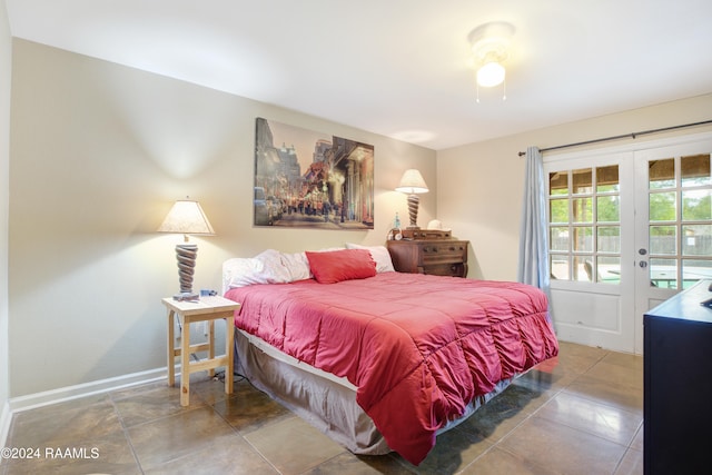 bedroom with tile patterned floors, french doors, and access to exterior