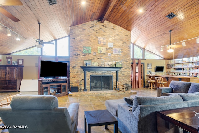 living room featuring high vaulted ceiling, plenty of natural light, and wooden ceiling