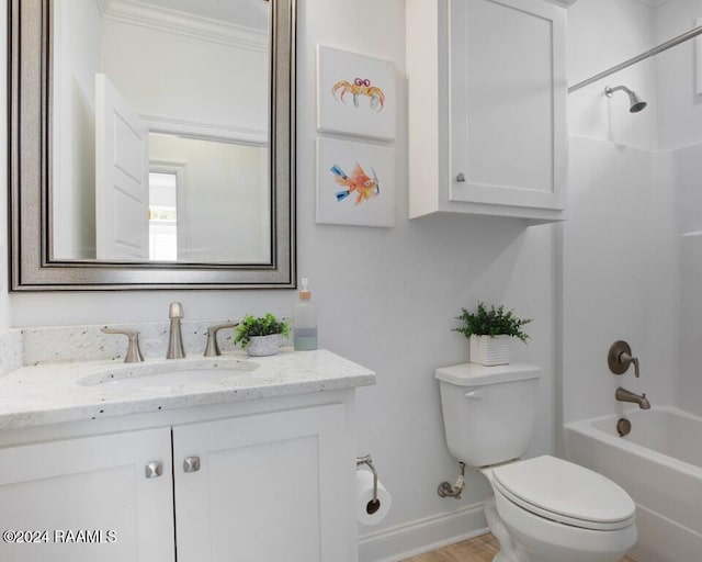 full bathroom featuring ornamental molding, shower / bath combination, vanity, and toilet