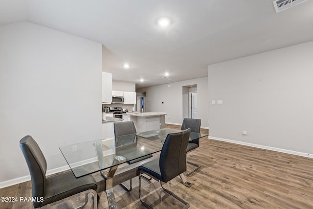 dining area with wood-type flooring