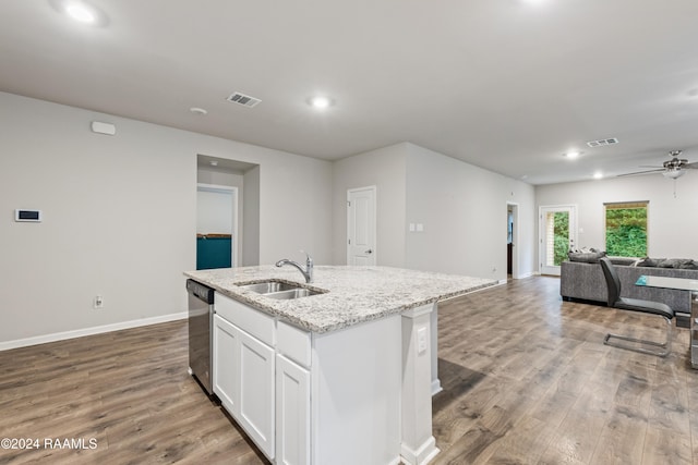 kitchen featuring white cabinetry, stainless steel dishwasher, hardwood / wood-style floors, and sink