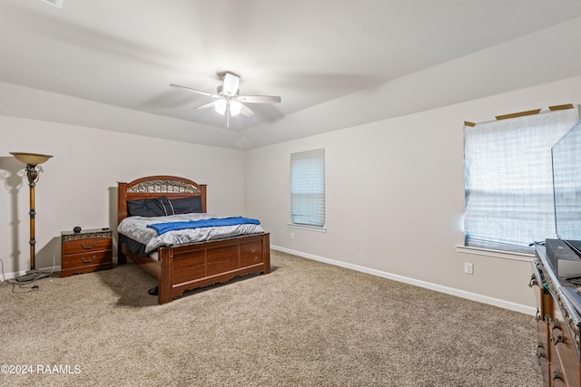 bedroom with ceiling fan and carpet floors