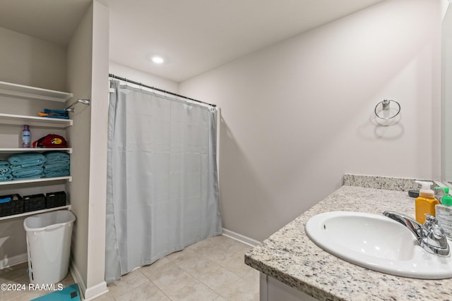 bathroom with tile patterned flooring, vanity, and a shower with shower curtain