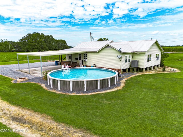 view of swimming pool with a lawn and a patio area