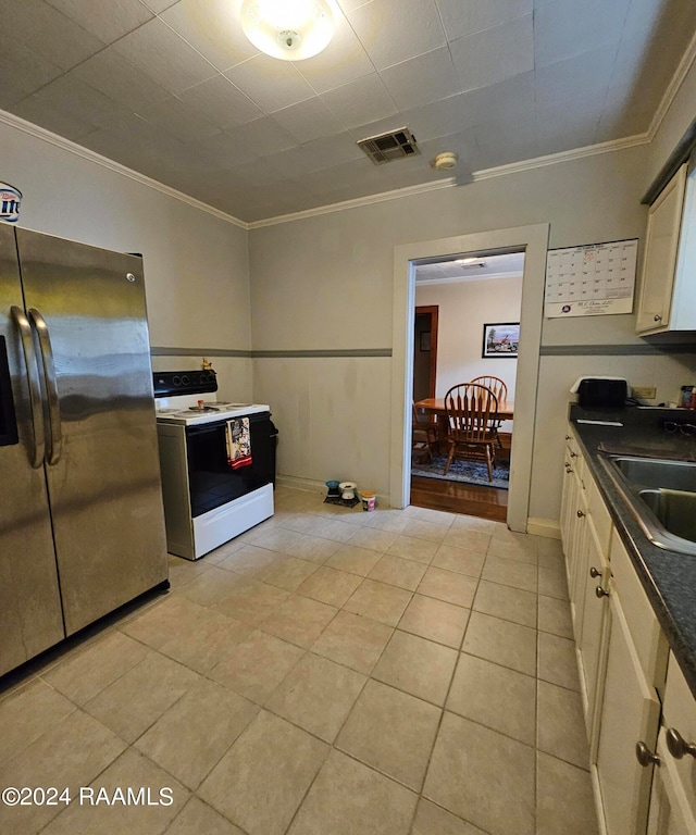 kitchen featuring stainless steel fridge, white electric range oven, light tile patterned floors, ornamental molding, and sink