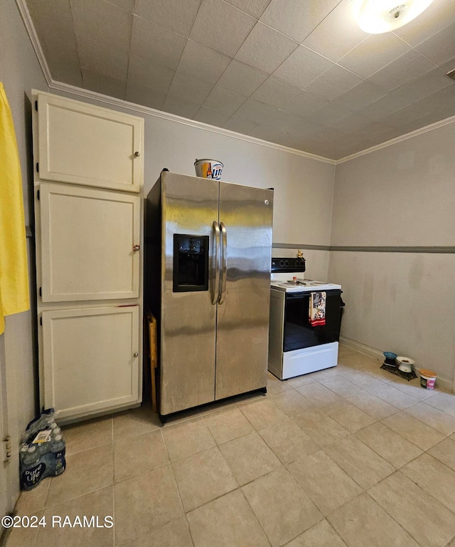 kitchen with crown molding, light tile patterned floors, stainless steel fridge with ice dispenser, and white range with electric stovetop