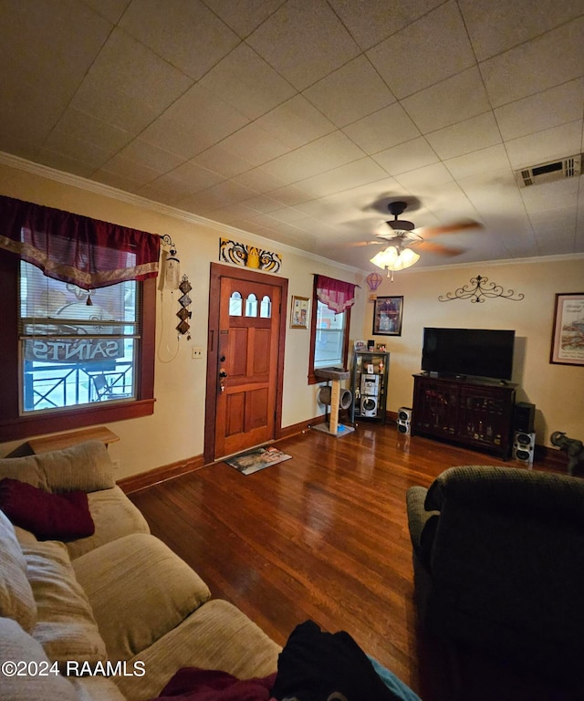 living room featuring wood-type flooring, ornamental molding, and ceiling fan