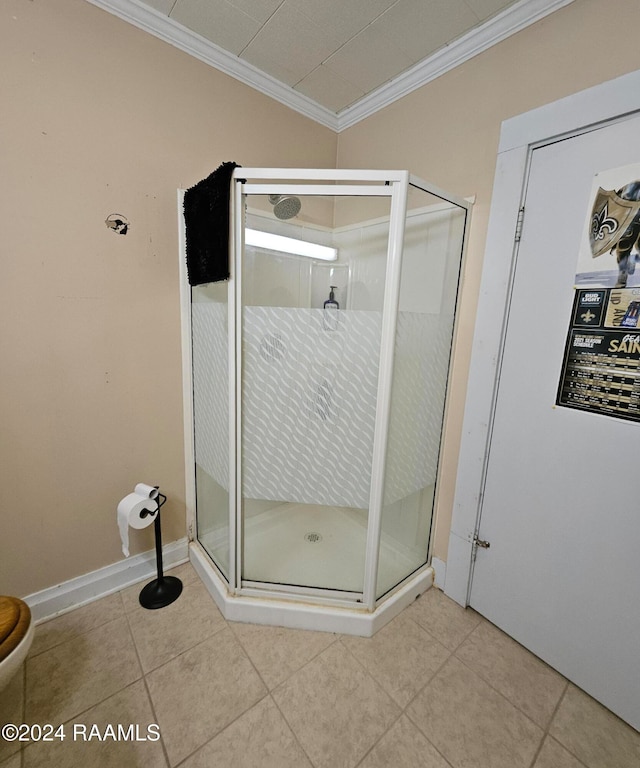 bathroom featuring walk in shower, tile patterned flooring, and ornamental molding