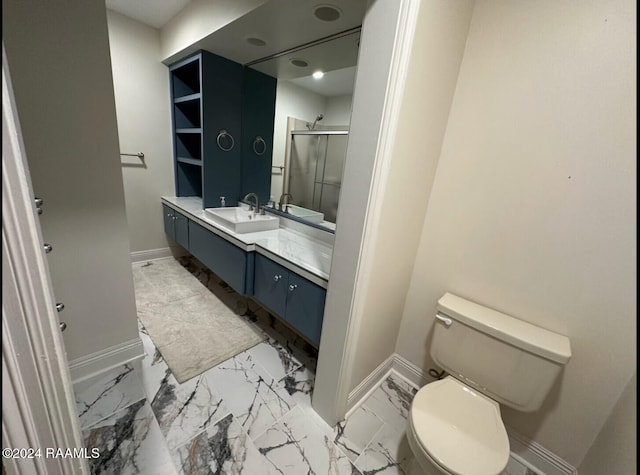 bathroom featuring vanity, toilet, and an enclosed shower