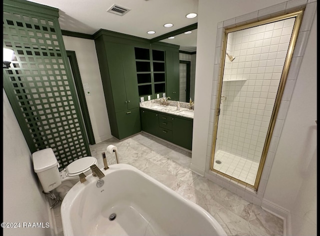 full bathroom featuring vanity, ornamental molding, toilet, and separate shower and tub