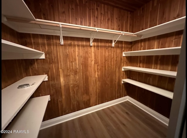 walk in closet featuring hardwood / wood-style flooring