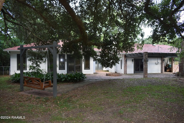 rear view of property with a patio area