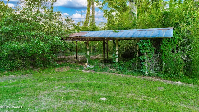 2862 S Union St, Opelousas, LA 70570 - view of grassy yard with a carport