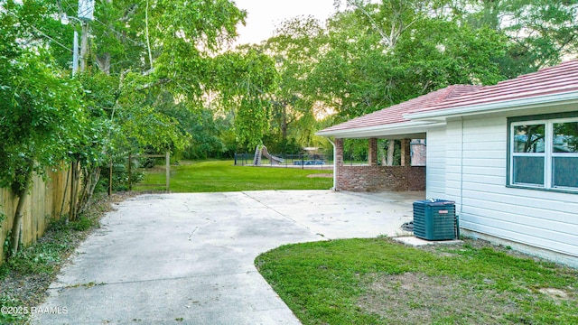 2862 S Union St, Opelousas, LA 70570 - view of yard with central AC unit, a patio, and view of scattered trees
