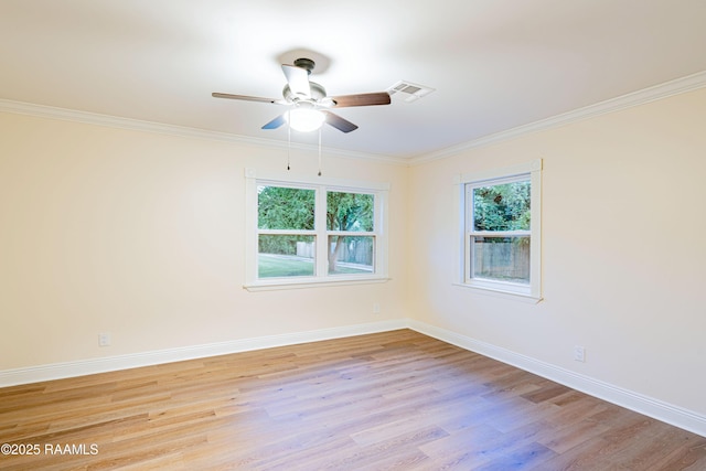 2862 S Union St, Opelousas, LA 70570 - spare room featuring light wood-type flooring, baseboards, a ceiling fan, and ornamental molding