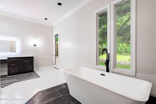 2862 S Union St, Opelousas, LA 70570 - bathroom with healthy amount of natural light, a soaking tub, vanity, crown molding, and recessed lighting
