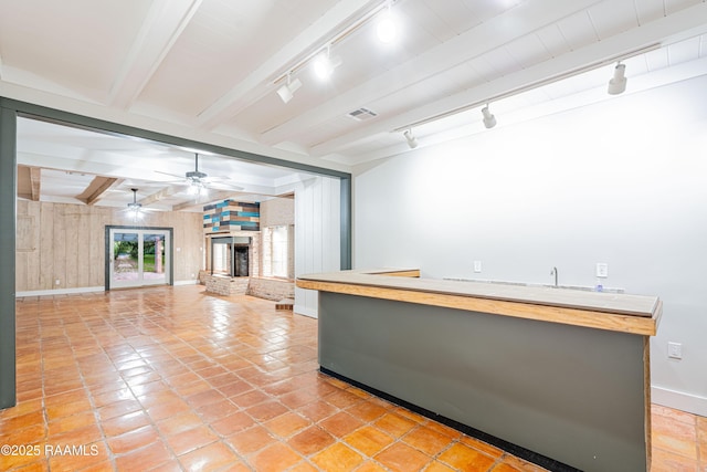 2862 S Union St, Opelousas, LA 70570 - bar area featuring track lighting, light tile patterned floors, baseboards, beamed ceiling, and ceiling fan