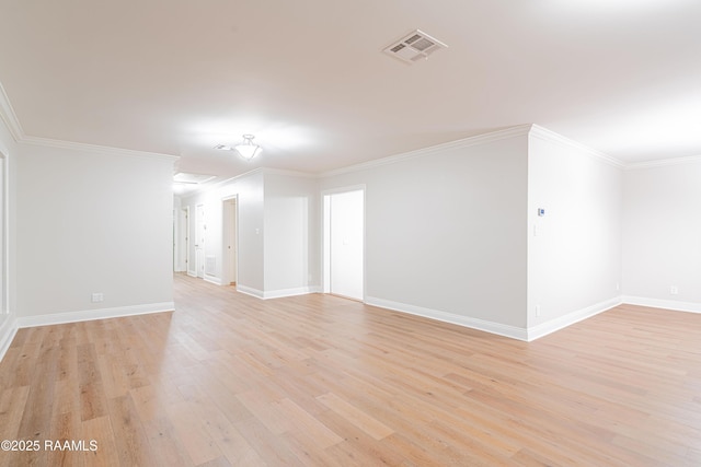 2862 S Union St, Opelousas, LA 70570 - spare room with light wood-type flooring, baseboards, and ornamental molding