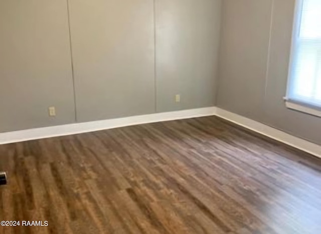 empty room featuring dark hardwood / wood-style floors