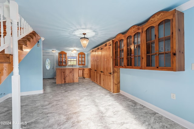 interior space featuring an inviting chandelier and decorative light fixtures