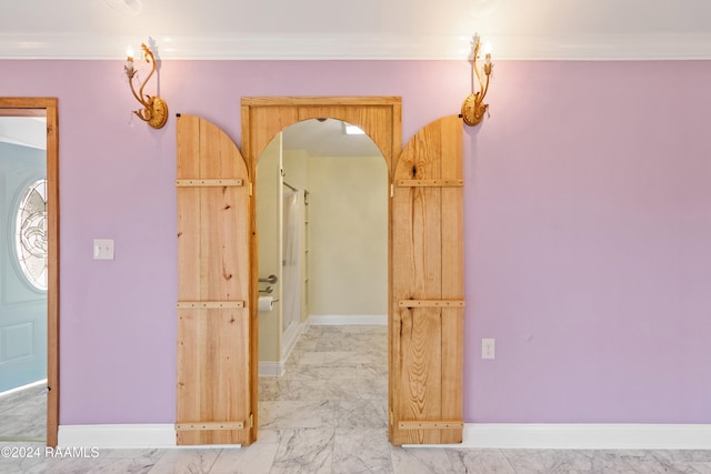 corridor featuring ornamental molding