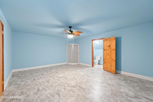 unfurnished bedroom with ensuite bath and ceiling fan