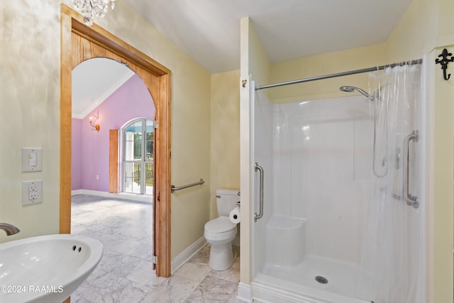 bathroom featuring walk in shower and toilet