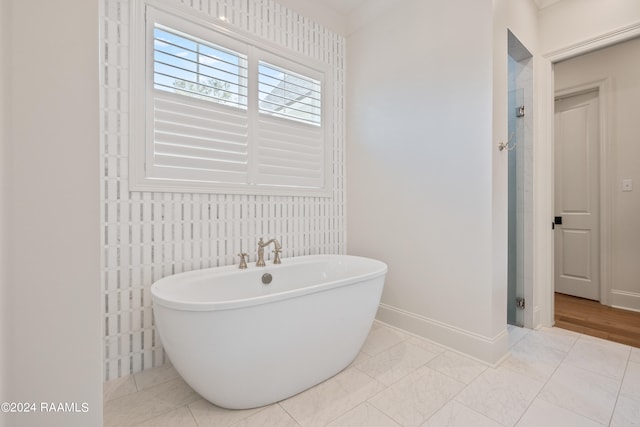 bathroom featuring tile walls, tile patterned floors, and shower with separate bathtub