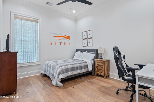 bedroom with light hardwood / wood-style flooring, multiple windows, and ceiling fan