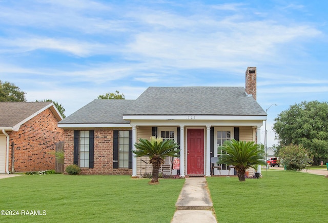 bungalow-style house featuring a garage and a front yard