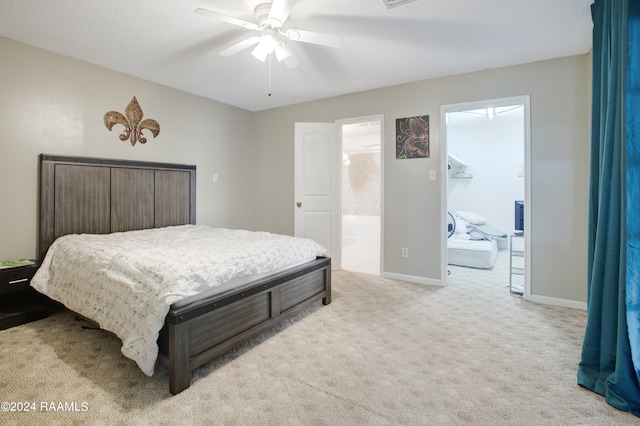 carpeted bedroom featuring connected bathroom and ceiling fan