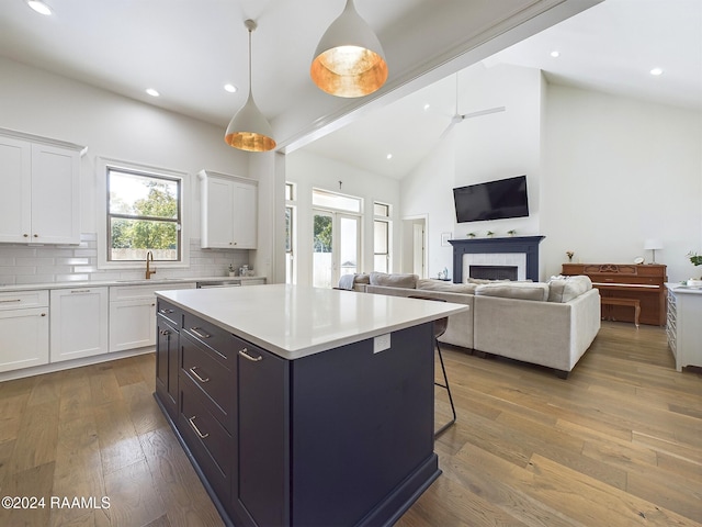 kitchen featuring a wealth of natural light and white cabinets