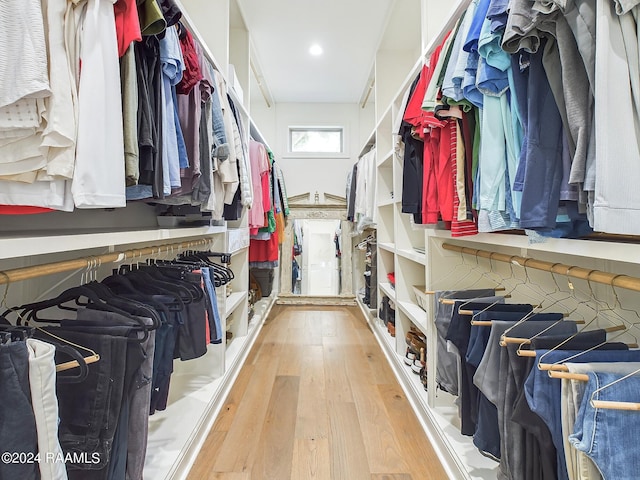 spacious closet with light hardwood / wood-style flooring