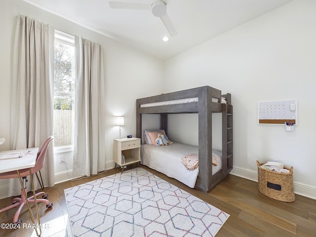 bedroom with ceiling fan and hardwood / wood-style floors