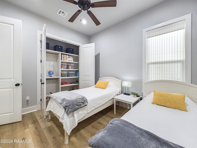 bedroom featuring ceiling fan and hardwood / wood-style floors