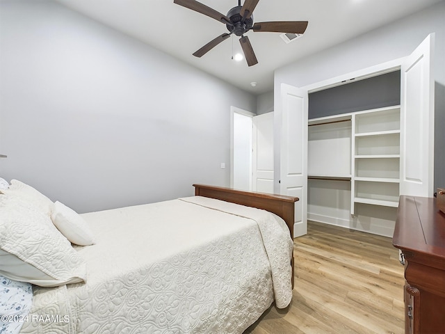 bedroom featuring a closet, ceiling fan, and hardwood / wood-style flooring