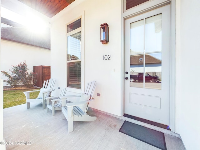 102 Blue Harbor Ln, Lafayette, LA 70503 - property entrance featuring stucco siding and covered porch