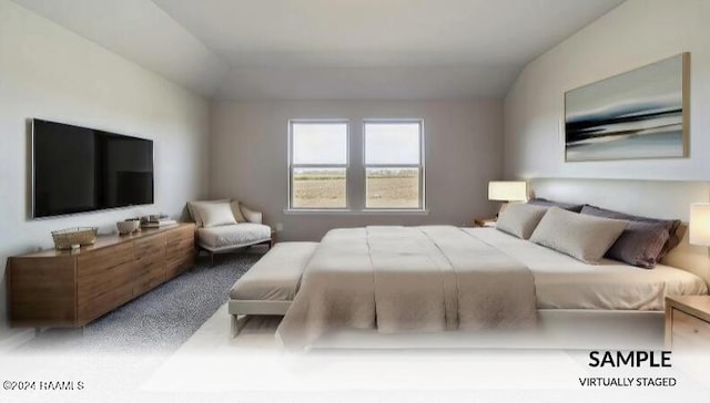 carpeted bedroom with lofted ceiling