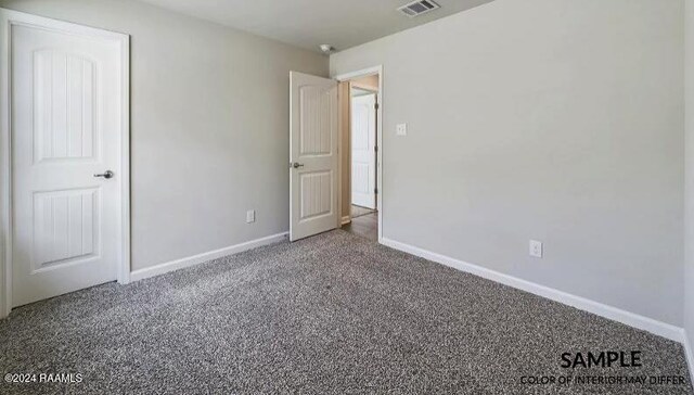 unfurnished bedroom featuring carpet