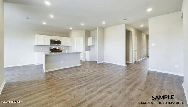 unfurnished living room with hardwood / wood-style flooring