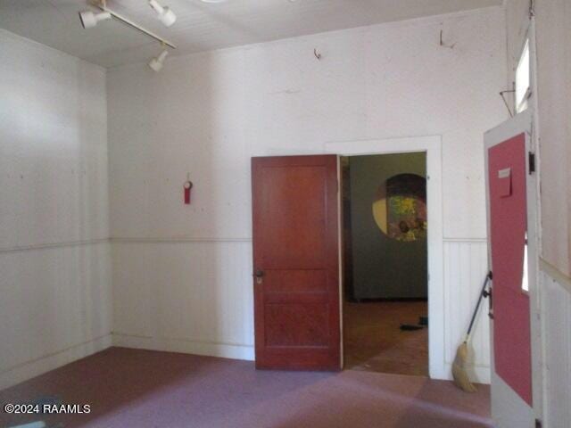 414 E Main St, Ville Platte, LA 70586 - empty room with wainscoting and a decorative wall