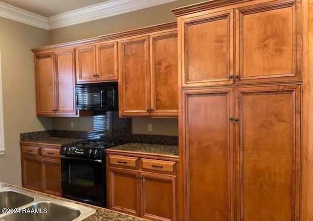 kitchen featuring crown molding, sink, and black appliances