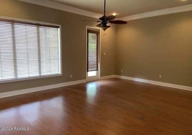 147 Oakbend Dr, Lafayette, LA 70506 - spare room with crown molding, baseboards, a ceiling fan, and wood finished floors