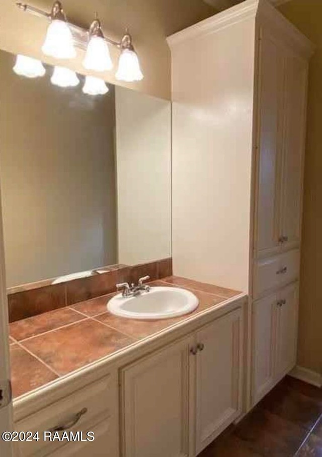 bathroom with tile patterned flooring and vanity