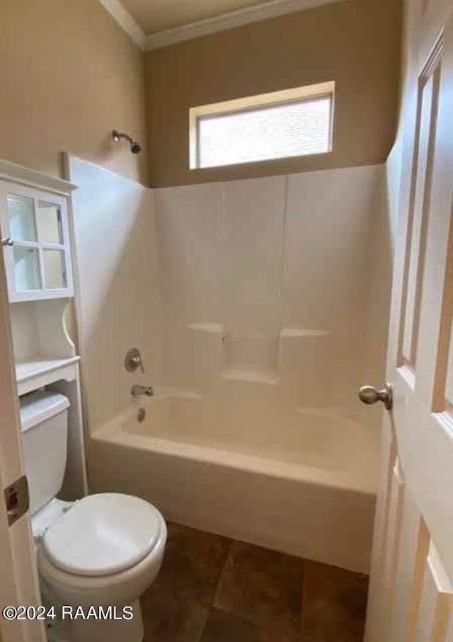 bathroom featuring tub / shower combination, ornamental molding, tile patterned flooring, and toilet