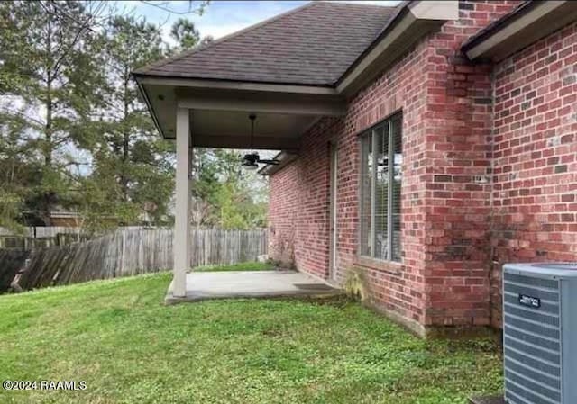 view of yard featuring cooling unit and a patio area